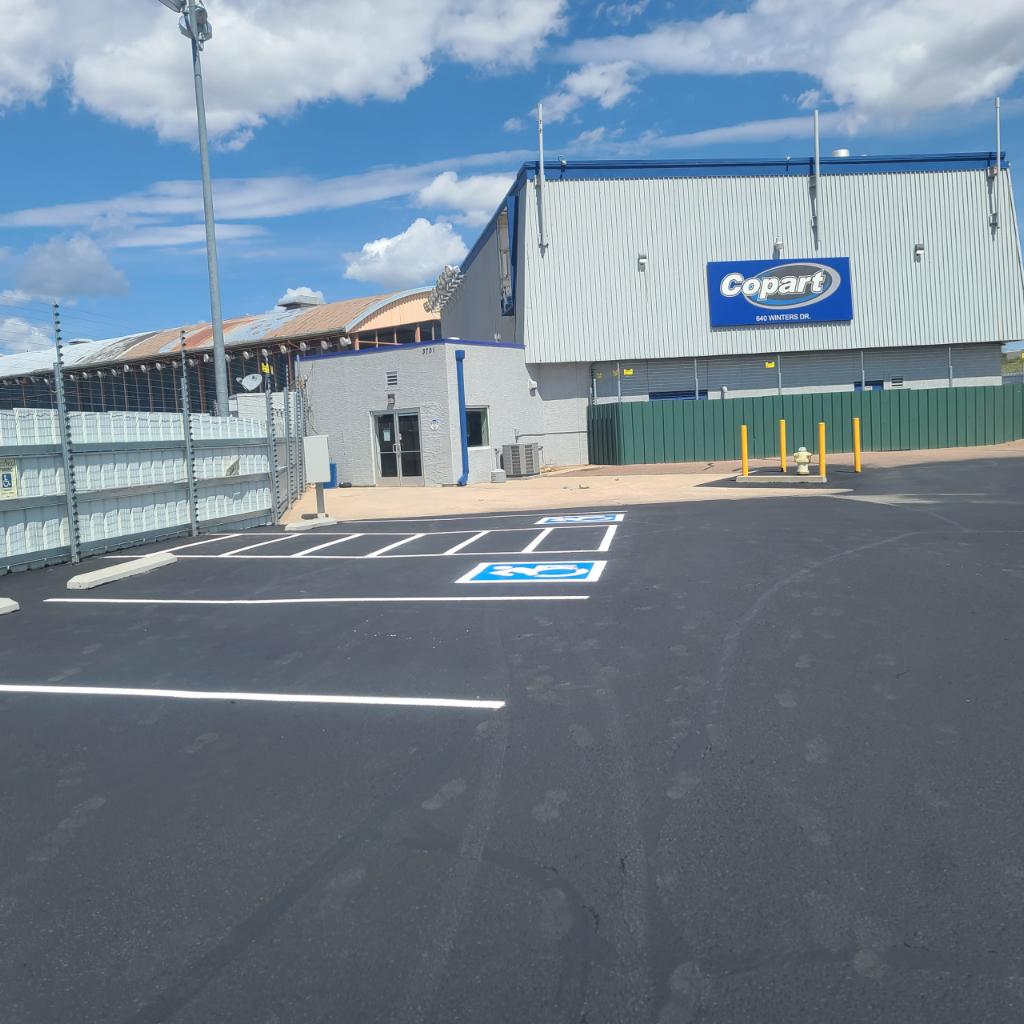 Fresh sealcoating applied to Copart parking lot Colorado Springs