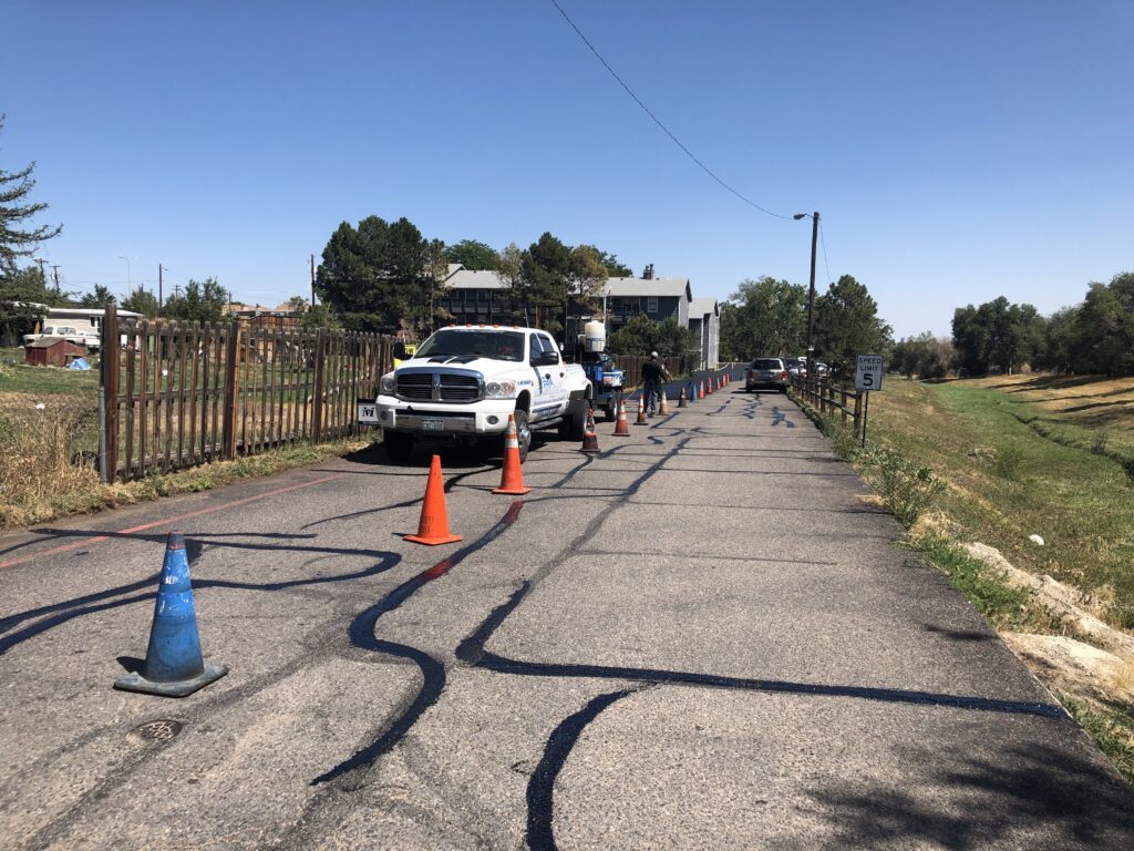 freeze thaw asphalt damage Colorado Springs driveway