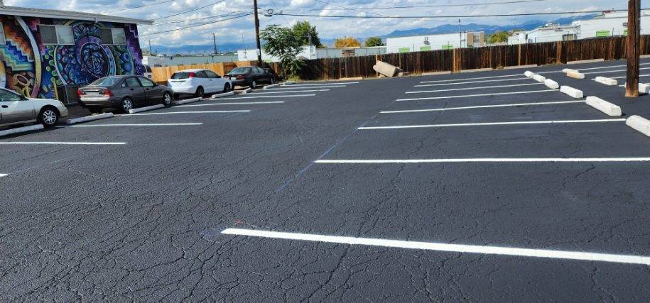 Commercial parking lot before and after sealcoating Colorado Springs