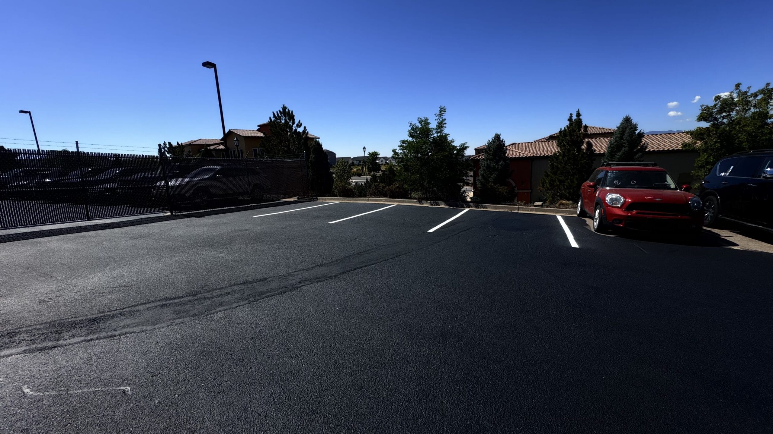 Phased commercial lot sealcoating around business hours Colorado Springs