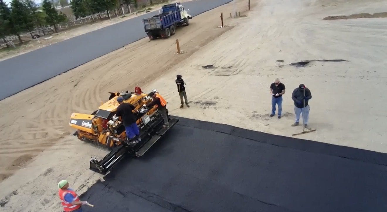 Asphalt paving crew installing pavement at The CDL School in Colorado Springs