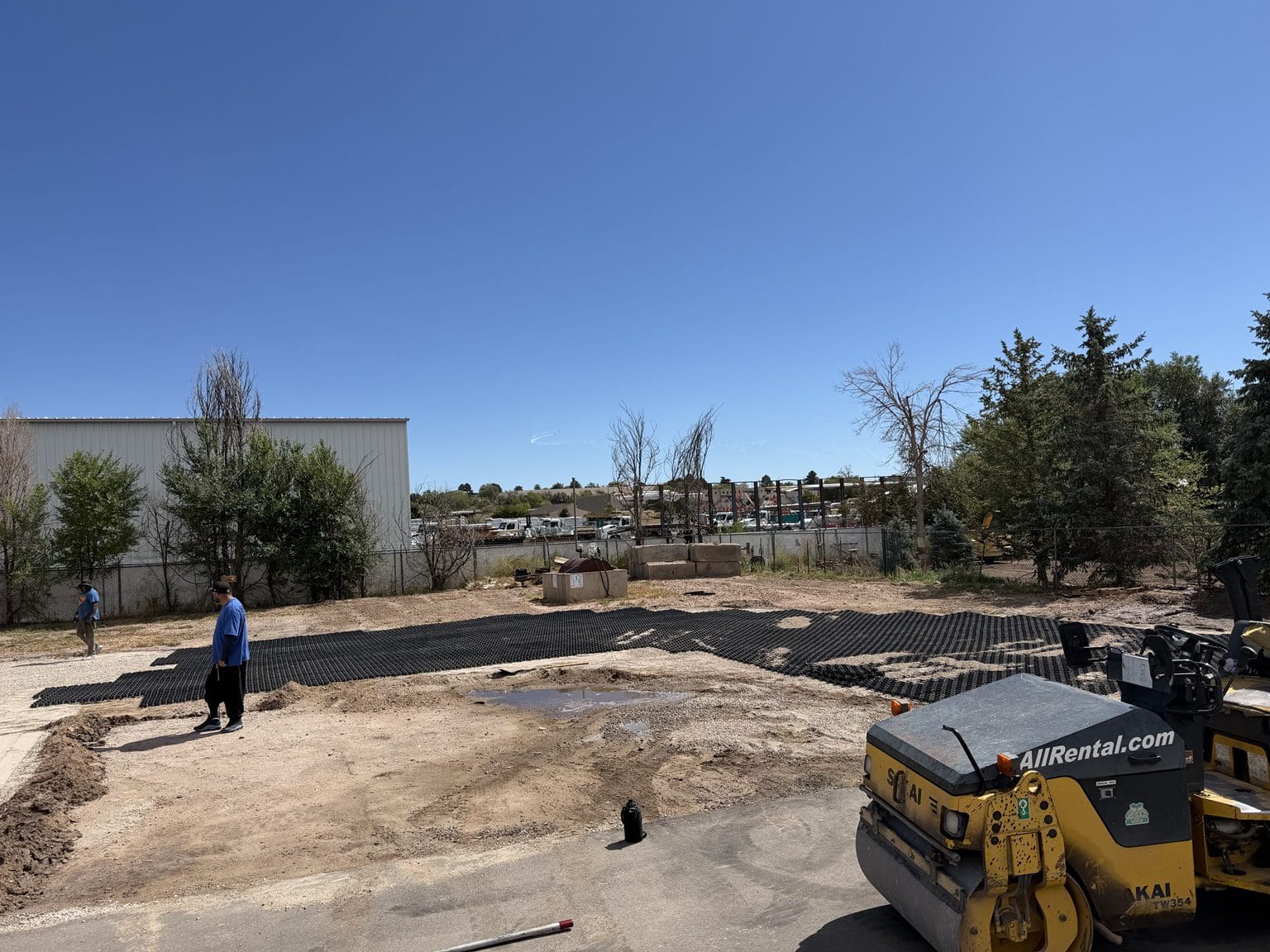 Equipment completing base preparation for The CDL School paving project