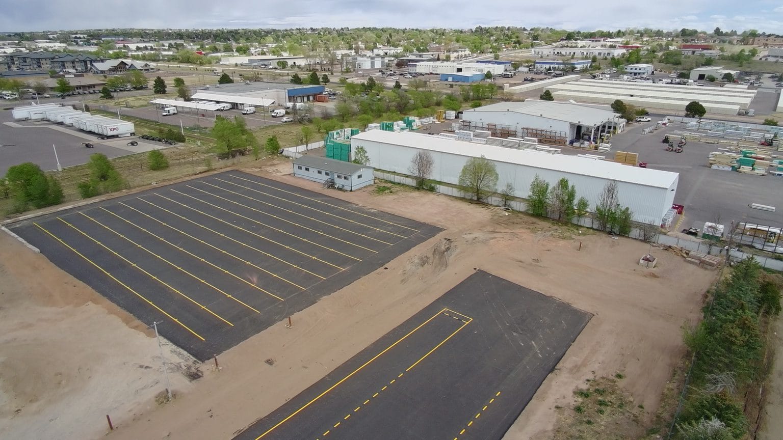 Aerial view of completed asphalt paving and striping at The CDL School