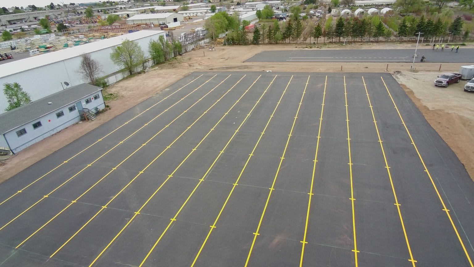 Completed yellow pavement striping at The CDL School