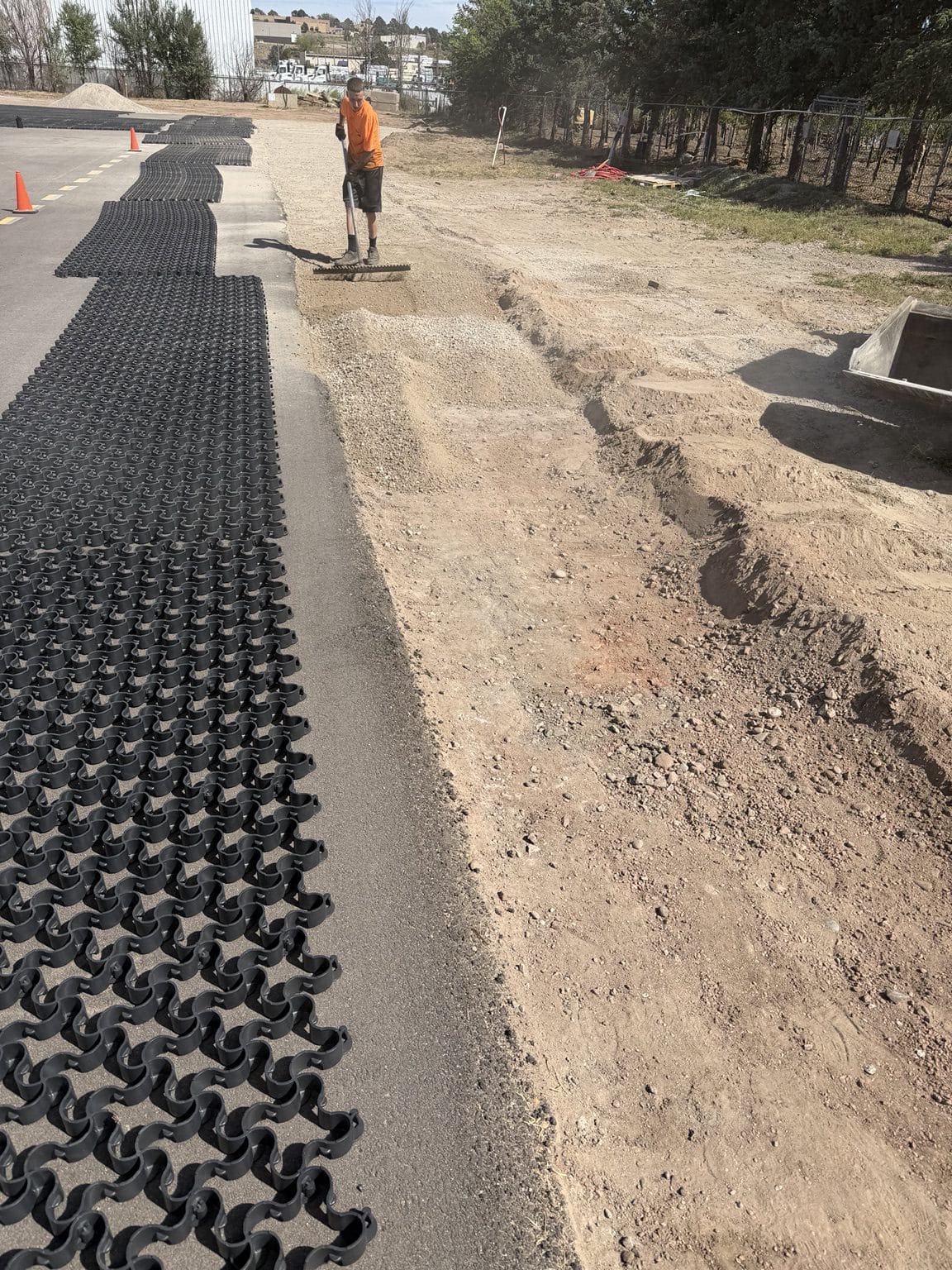 Tough Track reinforcement extending along the side of the asphalt surface
